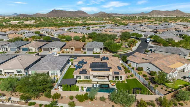 an aerial view of residential houses with outdoor space