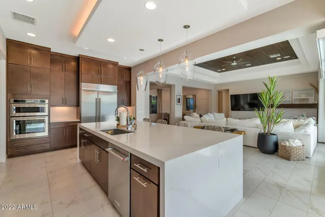 a large kitchen with stainless steel appliances lots of counter space