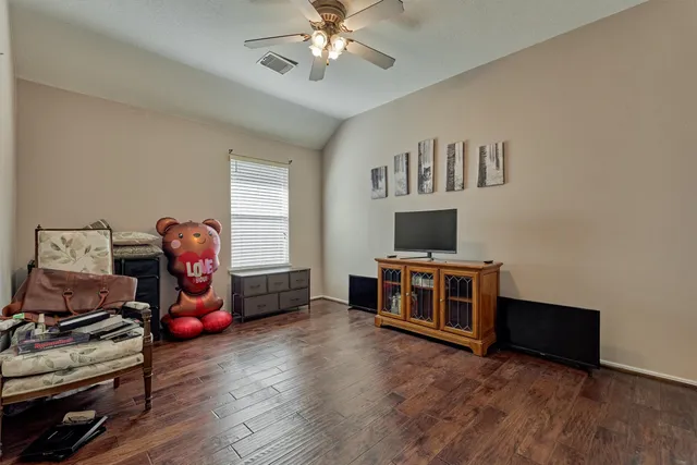 a bedroom with furniture and a window