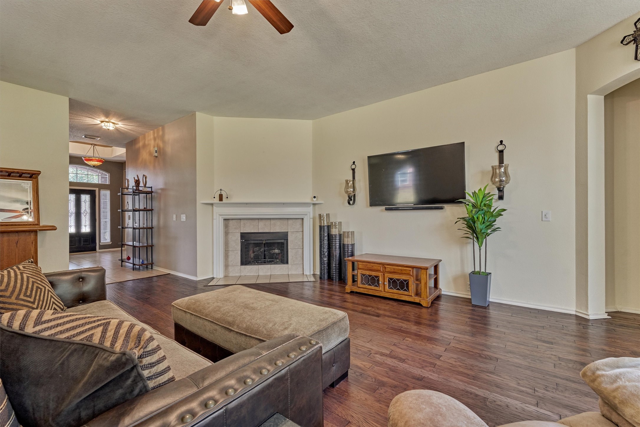 20835 Louetta Oak Drive Spring, TX 77388 - Photo 22 of 37 a living room with furniture fireplace and flat screen tv