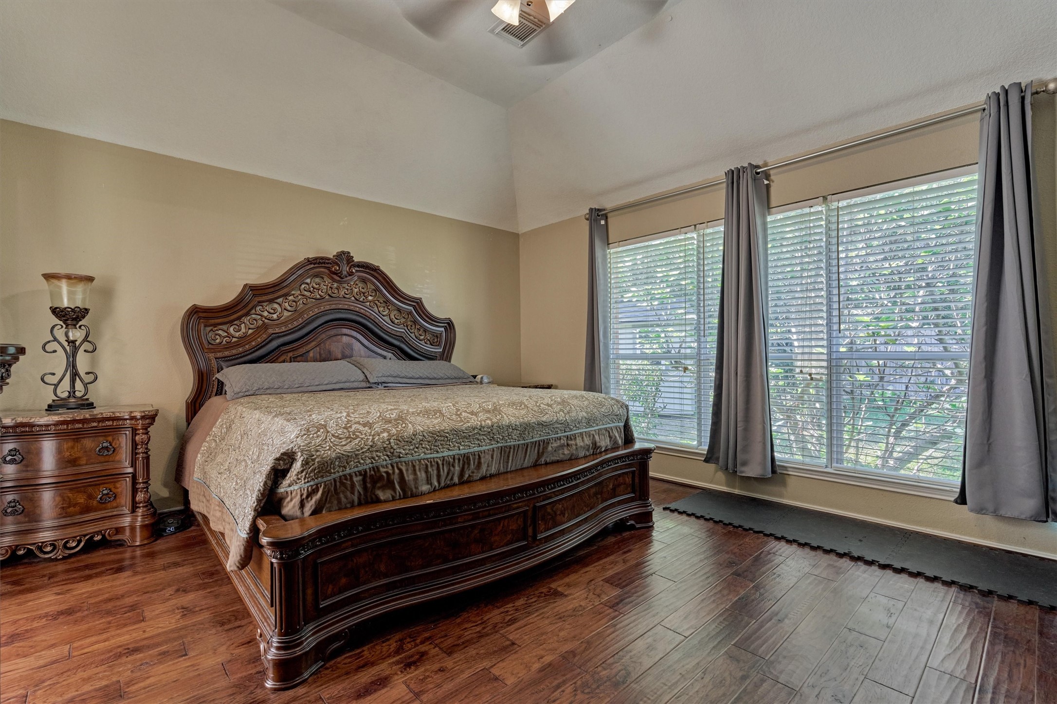 20835 Louetta Oak Drive Spring, TX 77388 - Photo 31 of 39 a bedroom with a bed and wooden floor