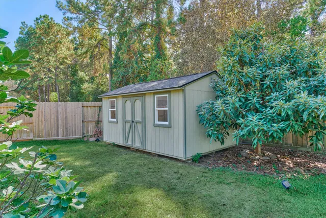 a backyard of a house with lots of green space