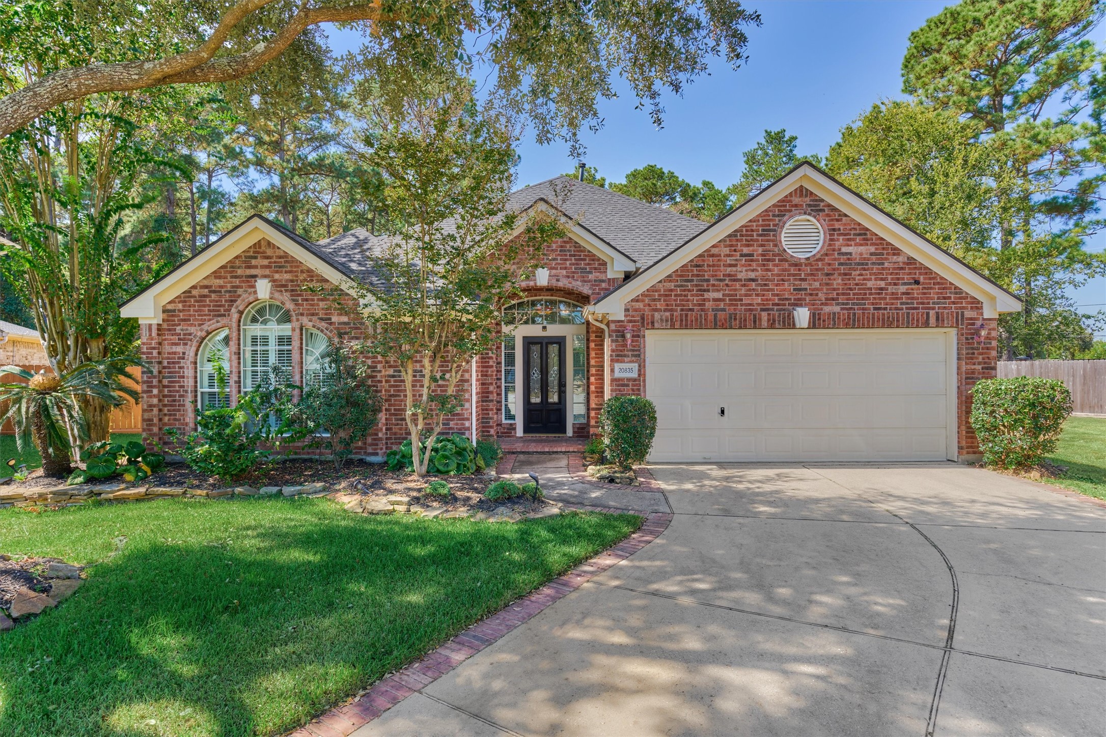 20835 Louetta Oak Drive Spring, TX 77388 - Photo 9 of 39 a front view of a house with a garden and plants