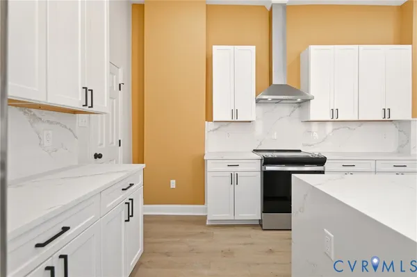 a kitchen with a refrigerator and a window