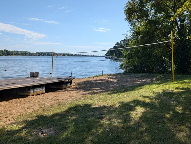 a view of swimming pool with a yard