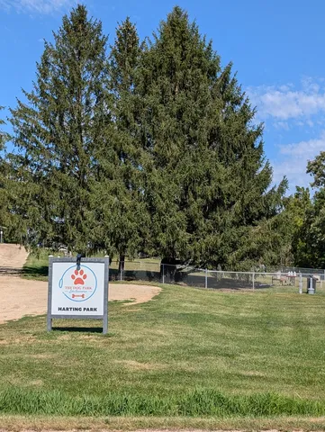 a view of a park with large trees