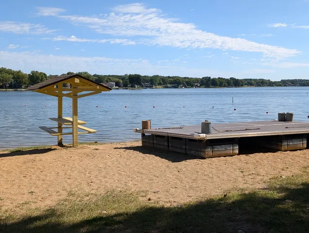 a view of a lake with houses in the back