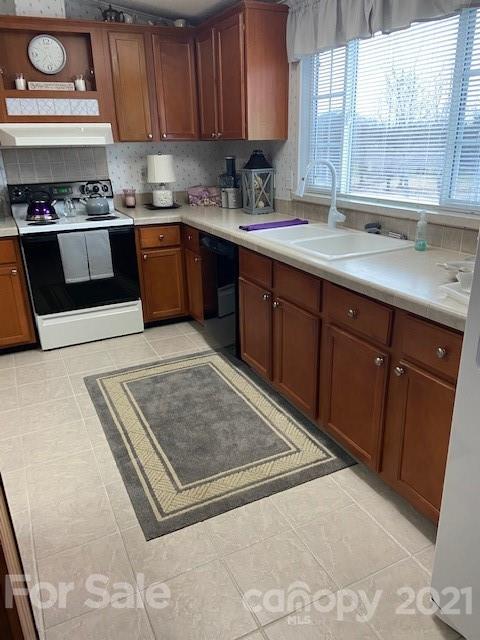 3296 Wike Road Catawba, NC 28609 - Photo 8 of 35 a kitchen with stainless steel appliances granite countertop a sink stove and window