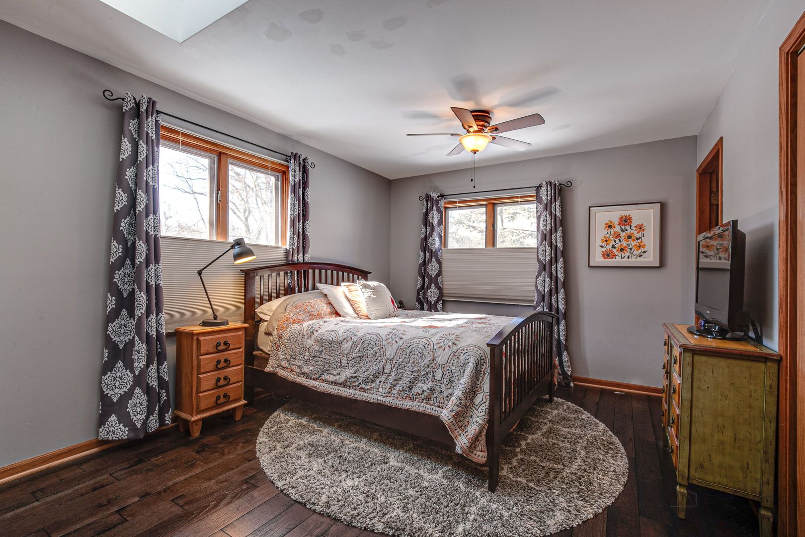 700 West Center Road Palatine, IL 60074 - Photo 15 of 32 a bed room with a bed window and a flat tv screen