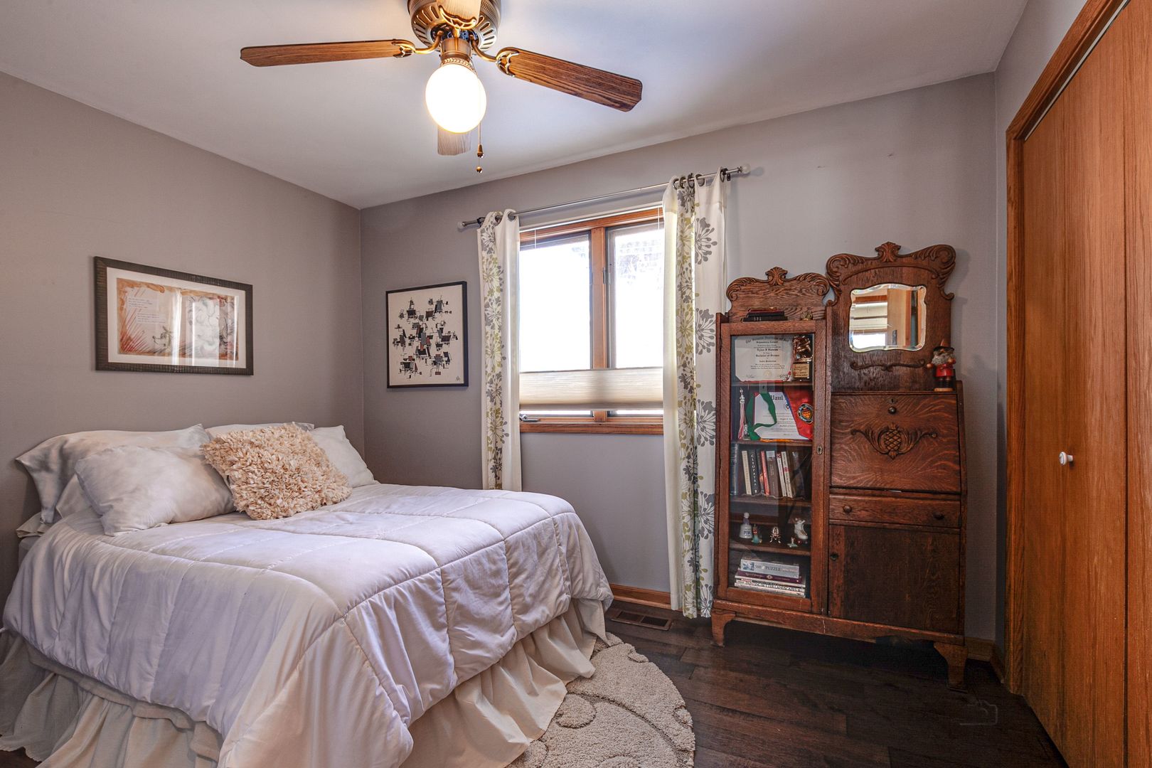 700 West Center Road Palatine, IL 60074 - Photo 18 of 32 a bedroom with a bed and a chandelier