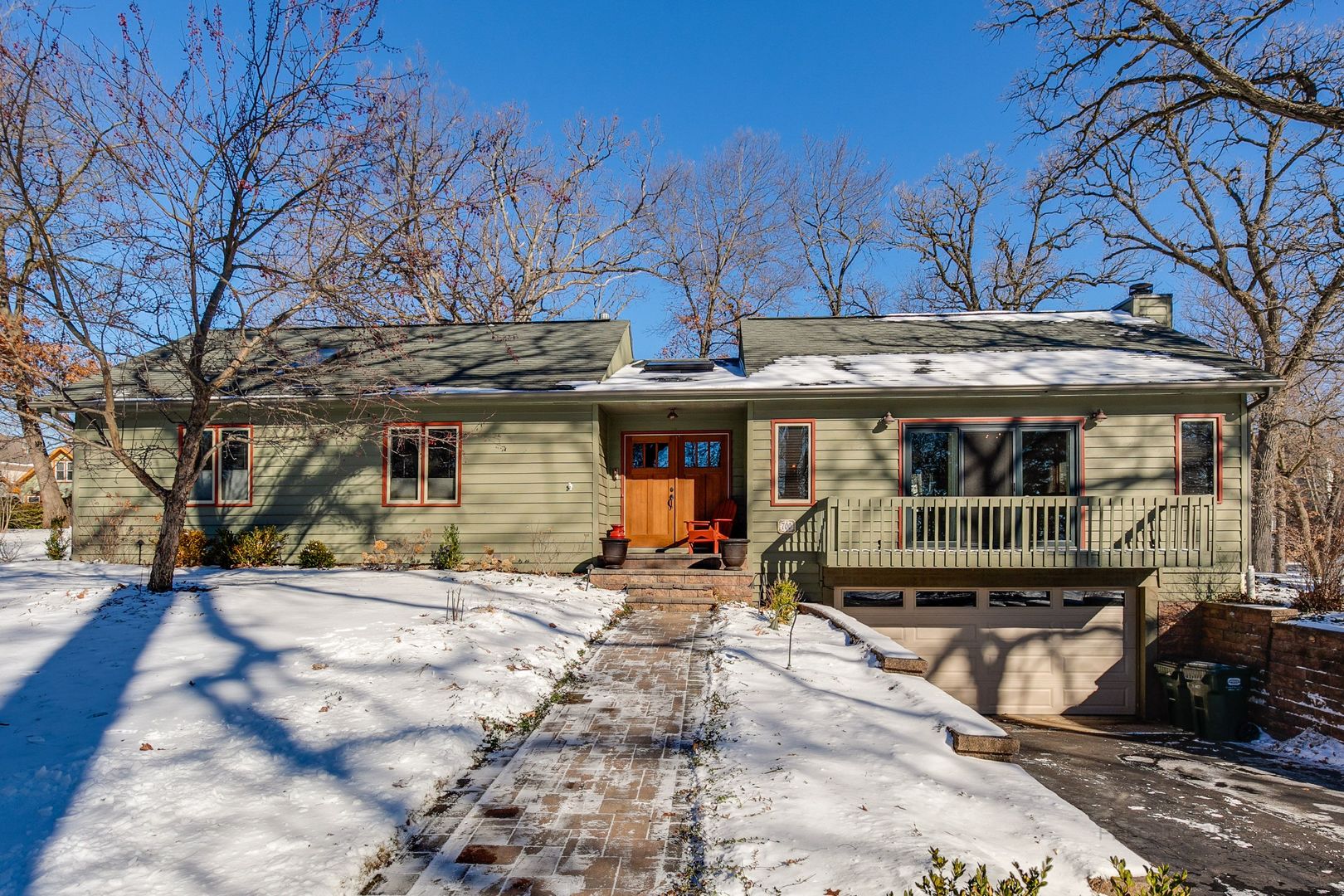 700 West Center Road Palatine, IL 60074 - Photo 2 of 32 a front view of a house with large trees