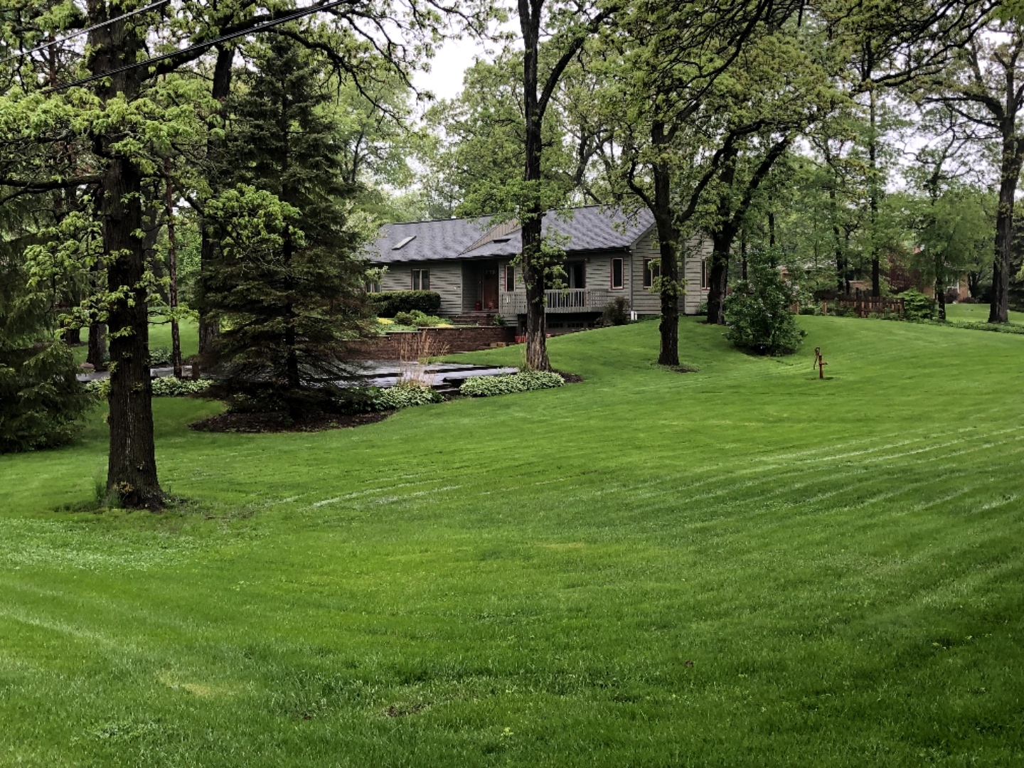700 West Center Road Palatine, IL 60074 - Photo 32 of 32 a front view of a house with a garden