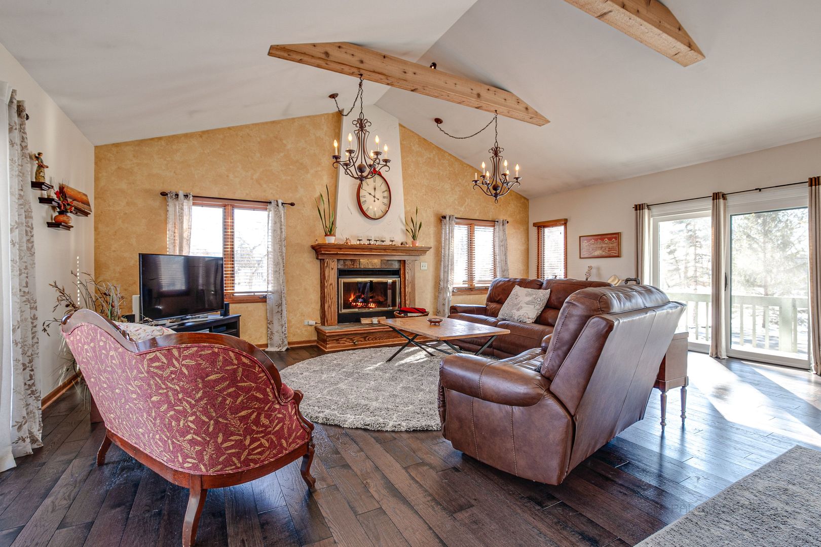 700 West Center Road Palatine, IL 60074 - Photo 7 of 32 a living room with furniture a fireplace and a flat screen tv