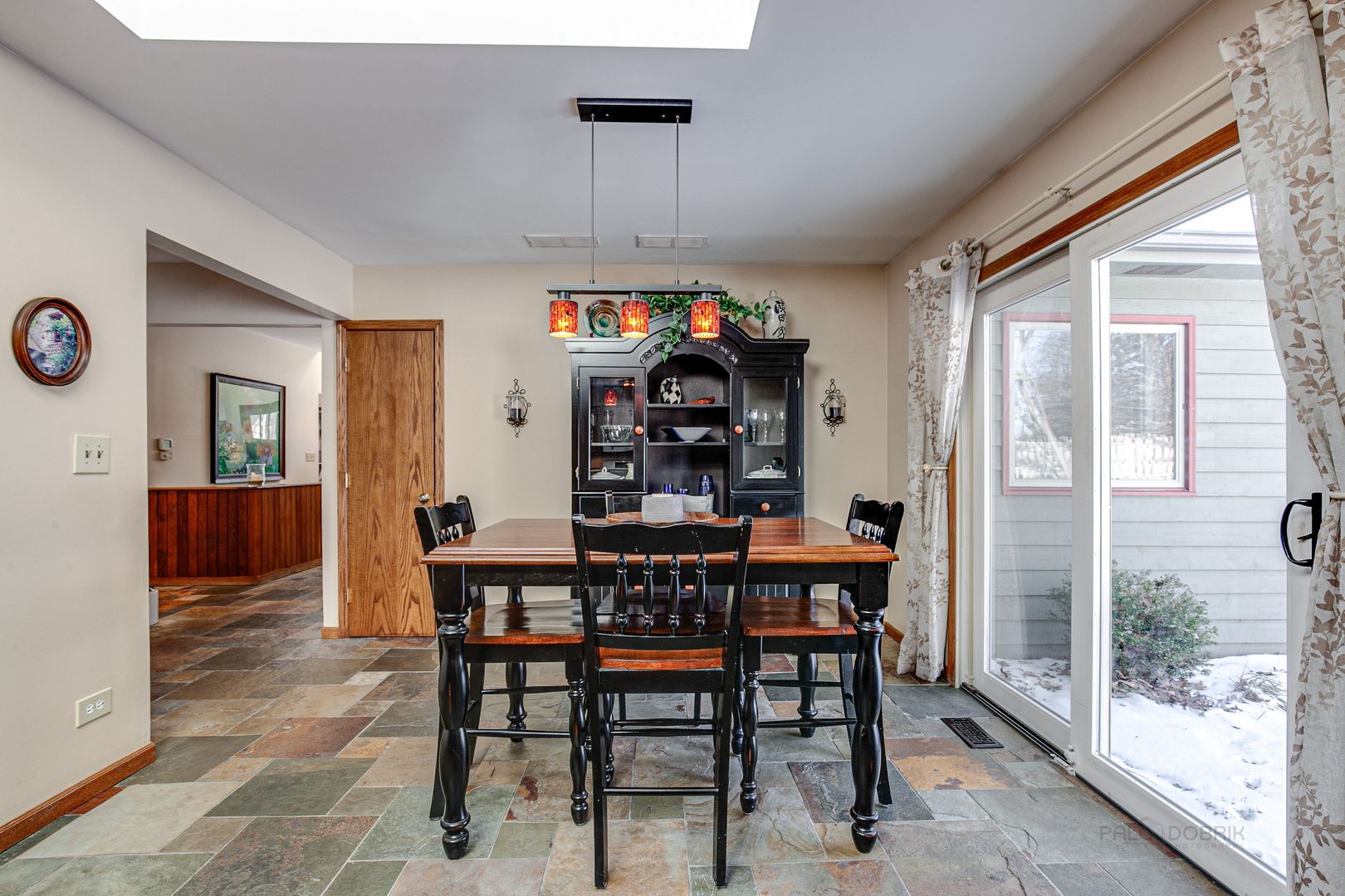 700 West Center Road Palatine, IL 60074 - Photo 9 of 32 a view of a dining room and livingroom with furniture window and wooden floor