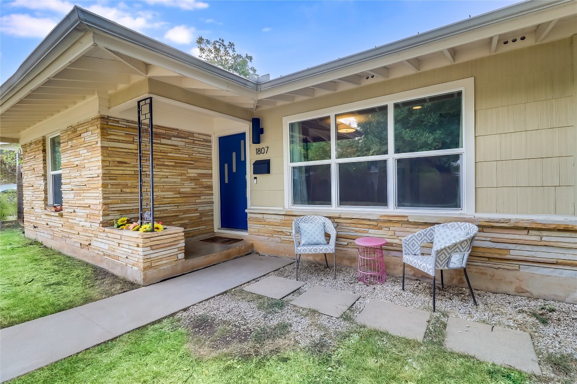 Property entrance featuring stone siding