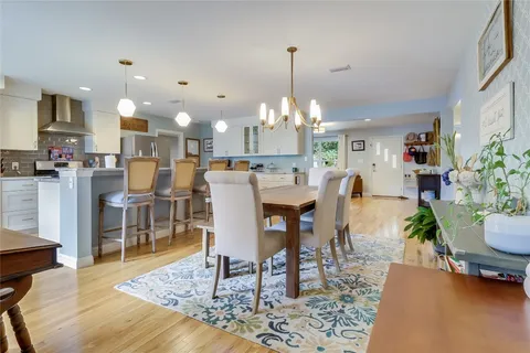 a living room with furniture and a book shelf