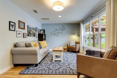 a living room with furniture and a rug