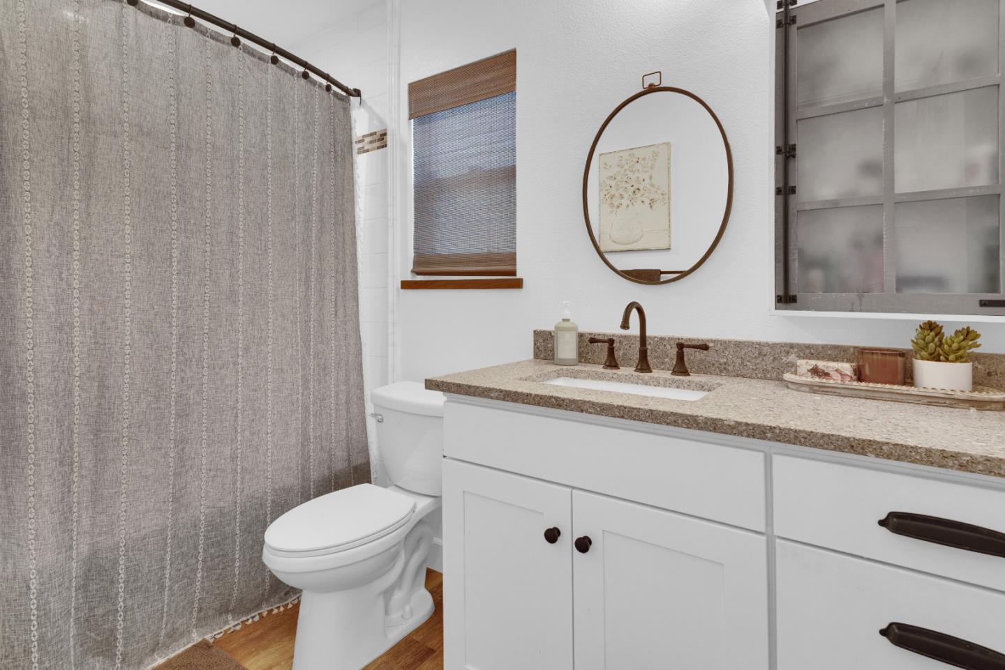 2182 Ridge Rider Road Bradley, CA 93426 - Photo 16 of 37 a bathroom with a granite countertop toilet a sink and a mirror