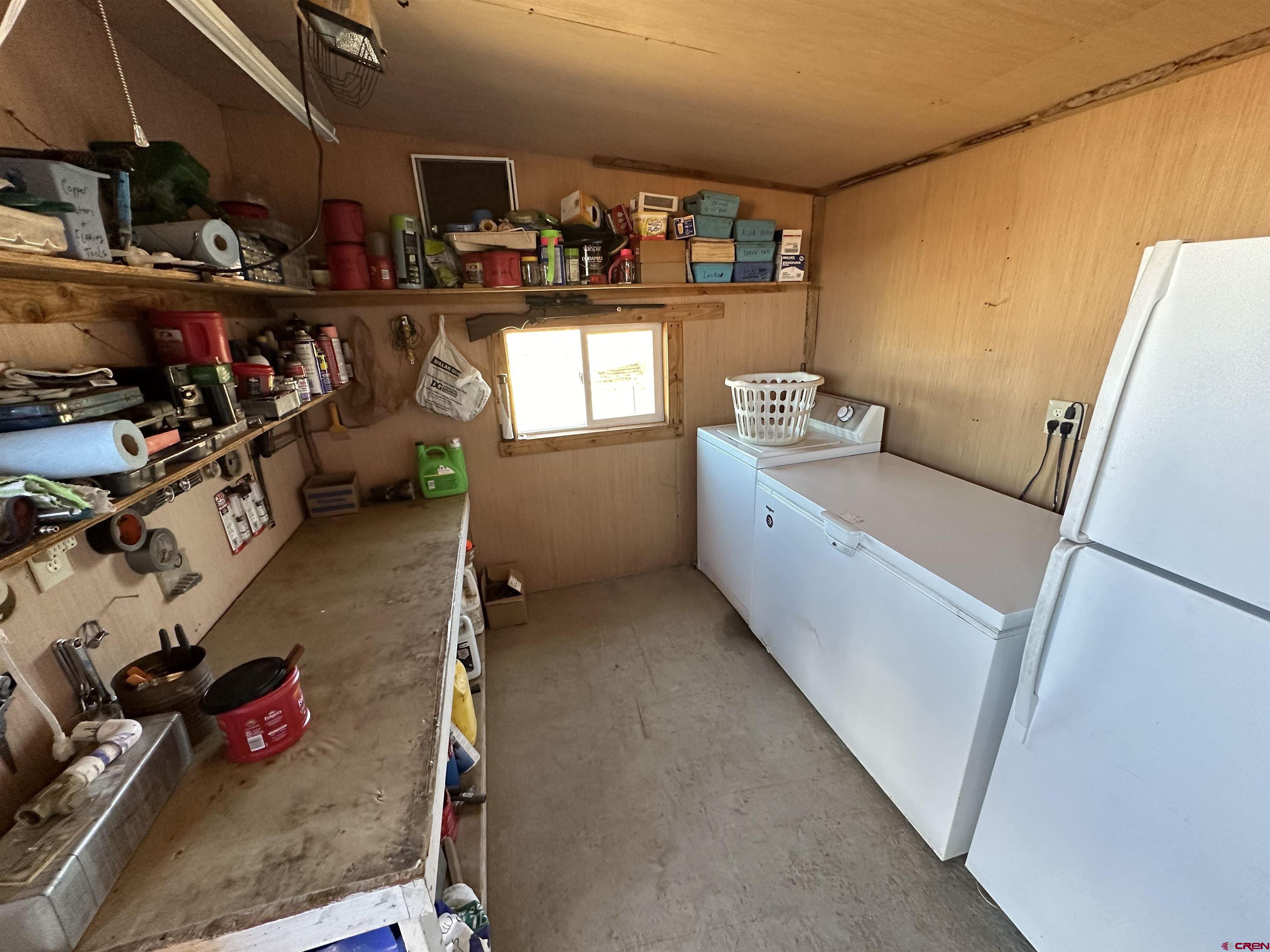 Tbd 8250th Road Crawford, CO 81415 - Photo 14 of 45 a storage room with washer and dryer
