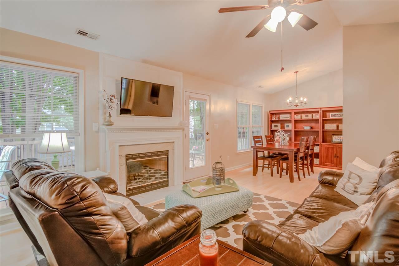 8640 Harps Mill Road Raleigh, NC 27615 - Photo 6 of 23 a living room with furniture and a fireplace