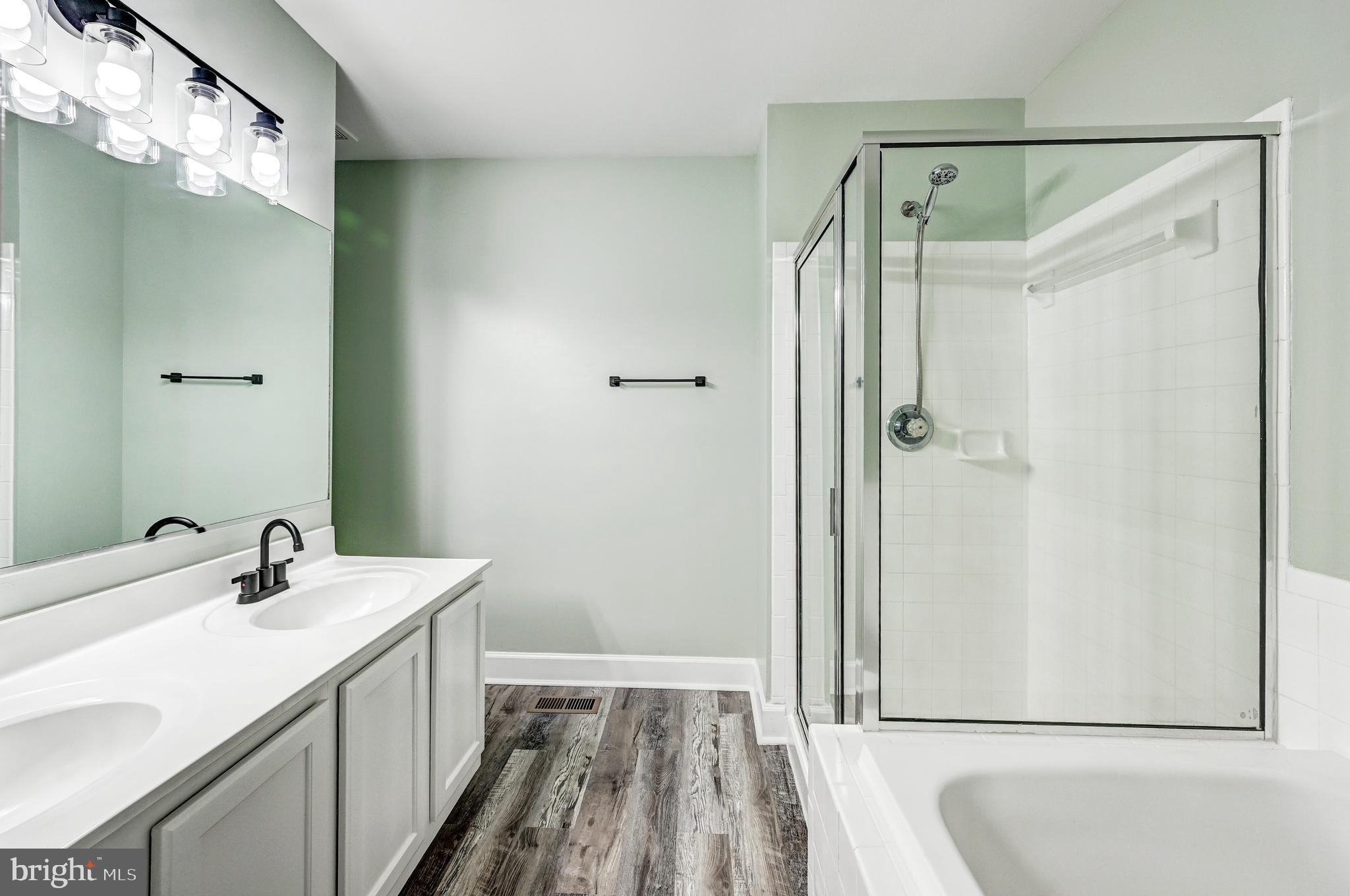 300 Roff Point Drive Odenton, MD 21113 - Photo 14 of 28 a bathroom with a sink and shower