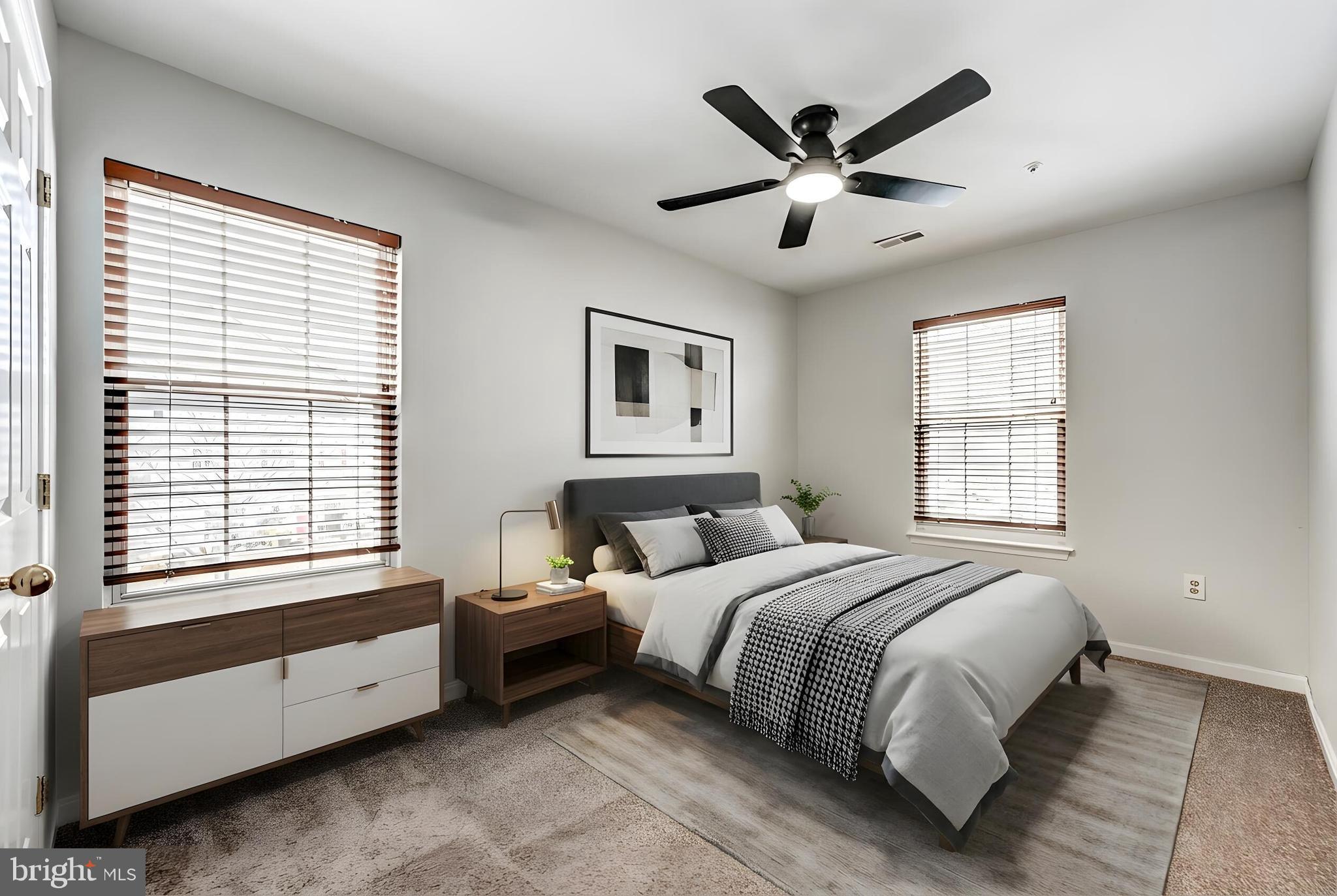 300 Roff Point Drive Odenton, MD 21113 - Photo 18 of 28 a bedroom with a large bed and a large window