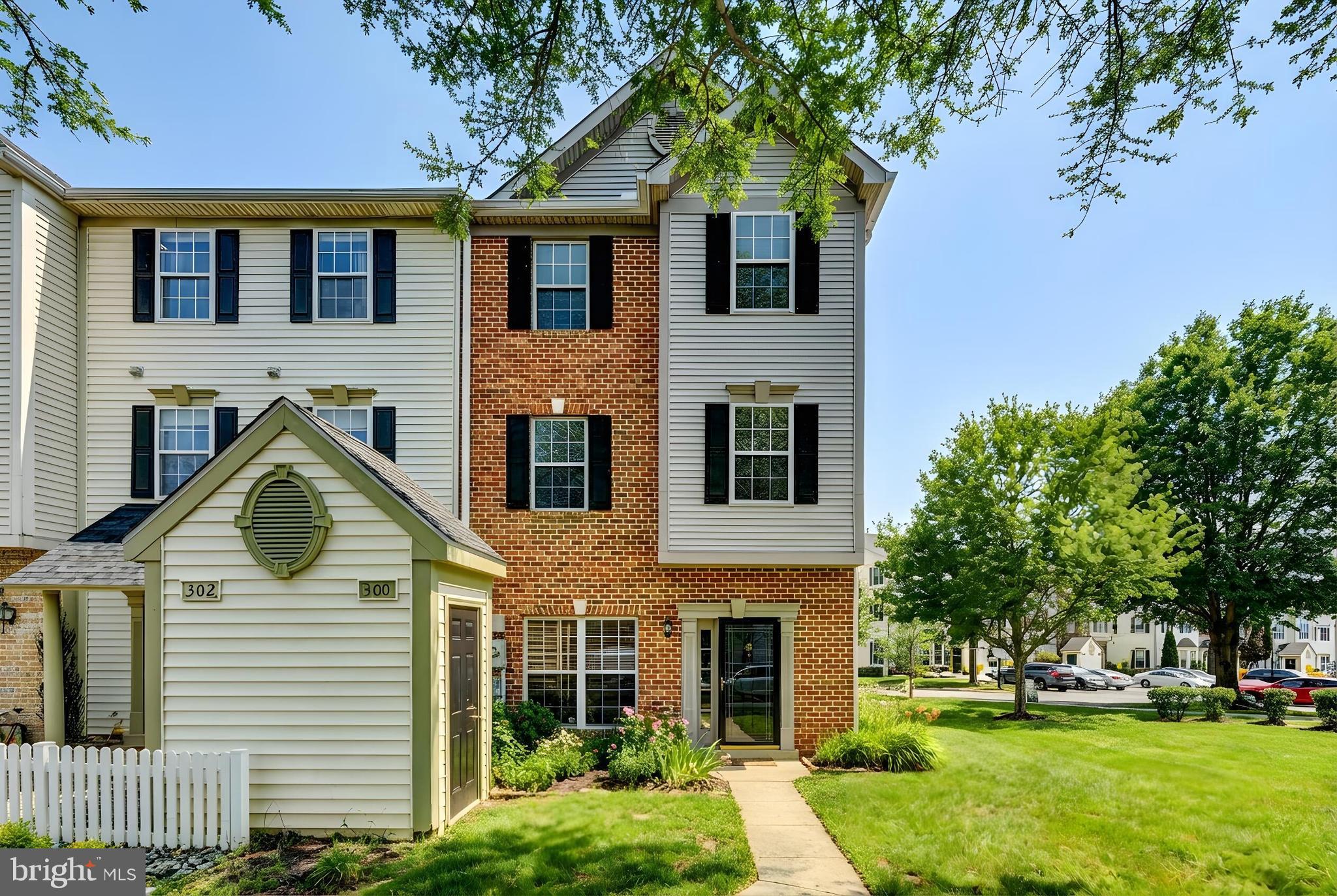 300 Roff Point Drive Odenton, MD 21113 - Photo 2 of 28 a front view of a house with a yard