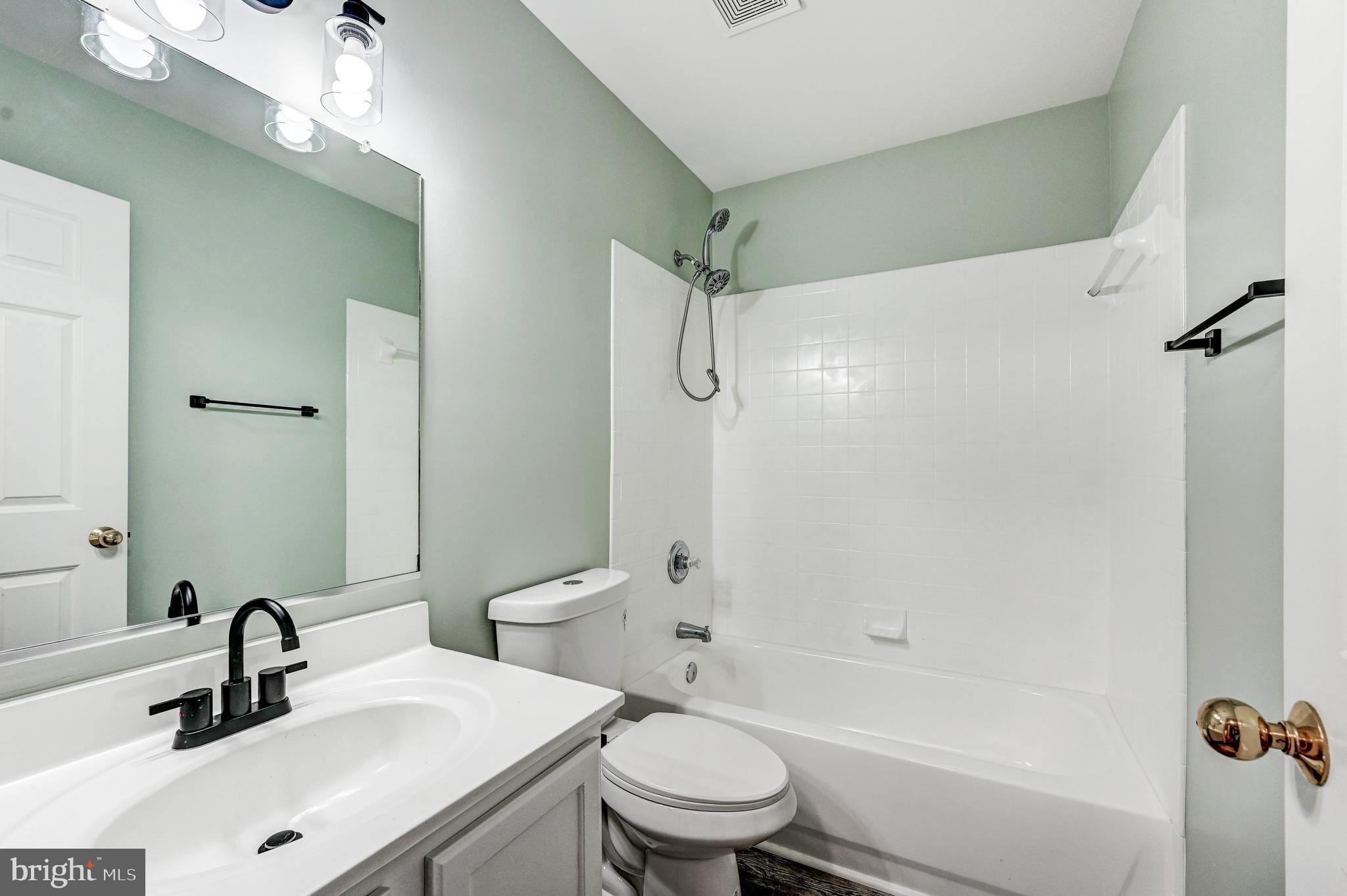 300 Roff Point Drive Odenton, MD 21113 - Photo 21 of 28 a bathroom with a sink toilet and shower