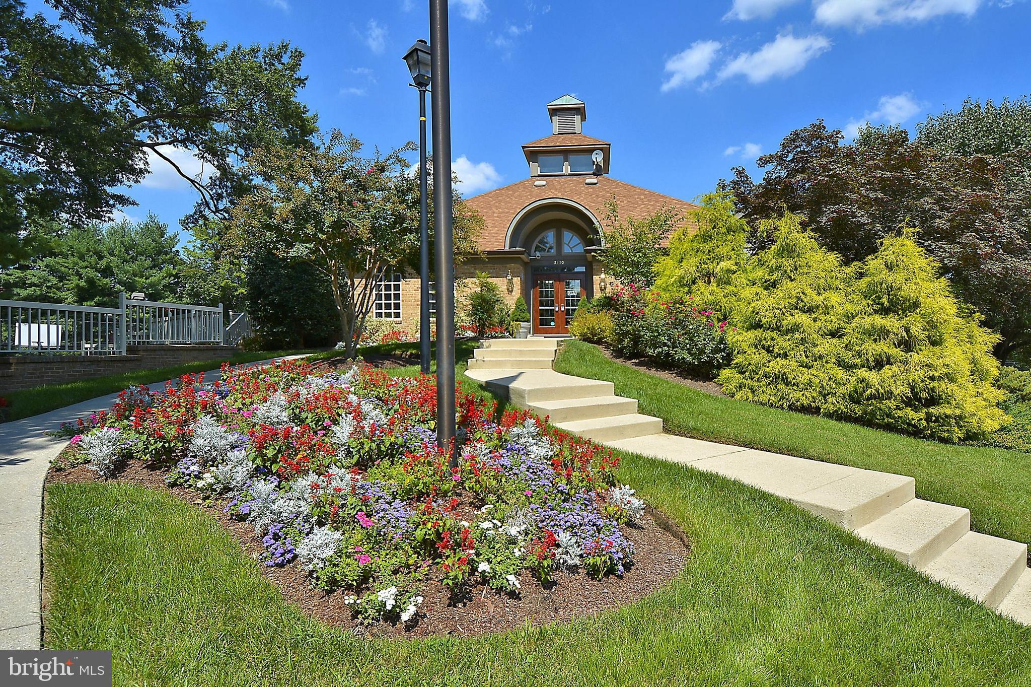 300 Roff Point Drive Odenton, MD 21113 - Photo 23 of 28 a front view of a house with garden