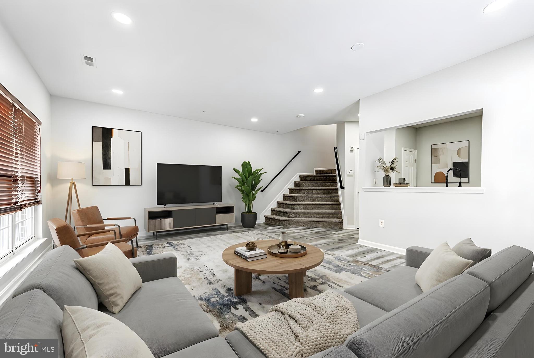 300 Roff Point Drive Odenton, MD 21113 - Photo 4 of 28 a living room with furniture and a flat screen tv