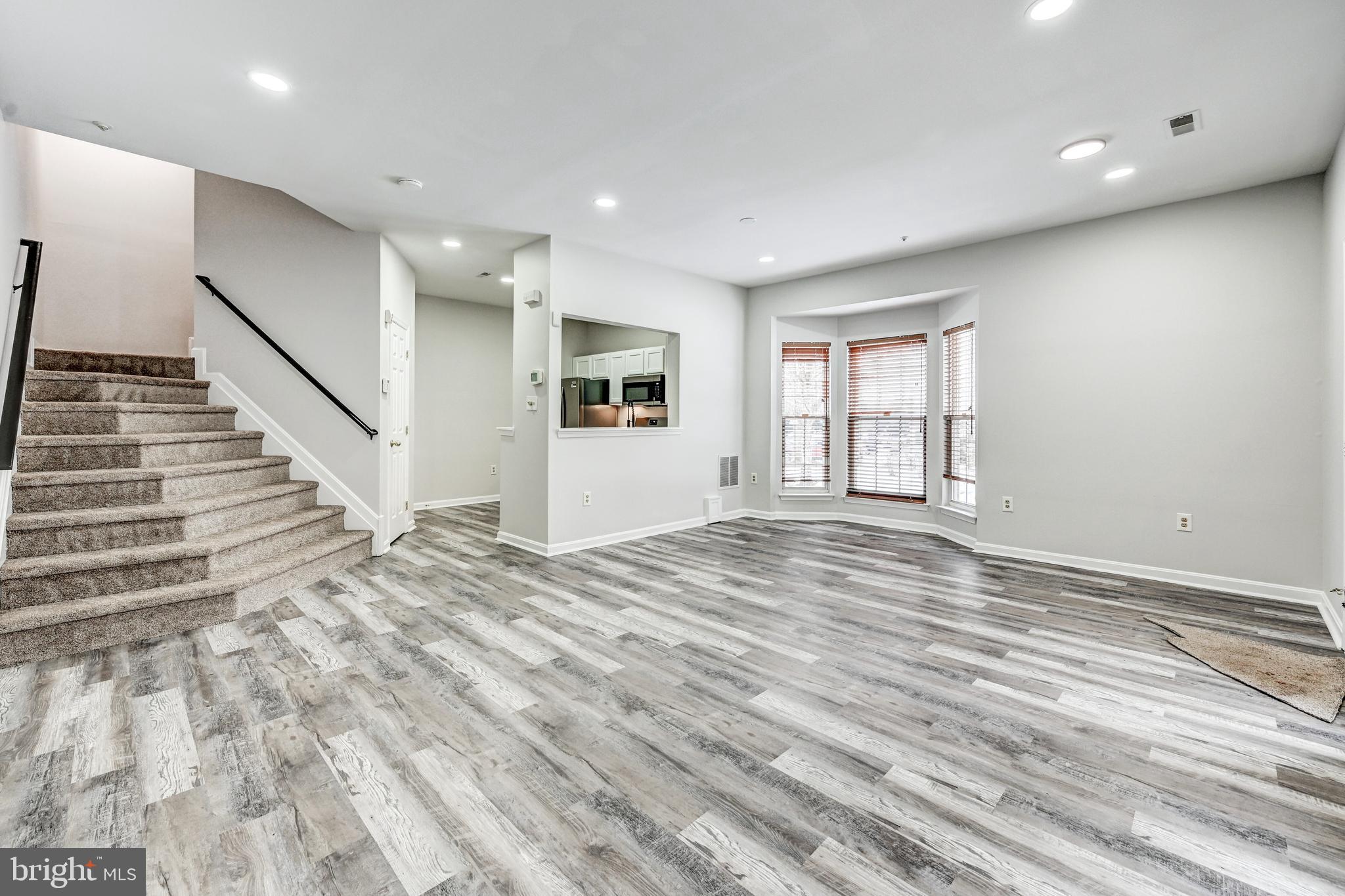 300 Roff Point Drive Odenton, MD 21113 - Photo 6 of 28 a view of empty room with wooden floor and fan