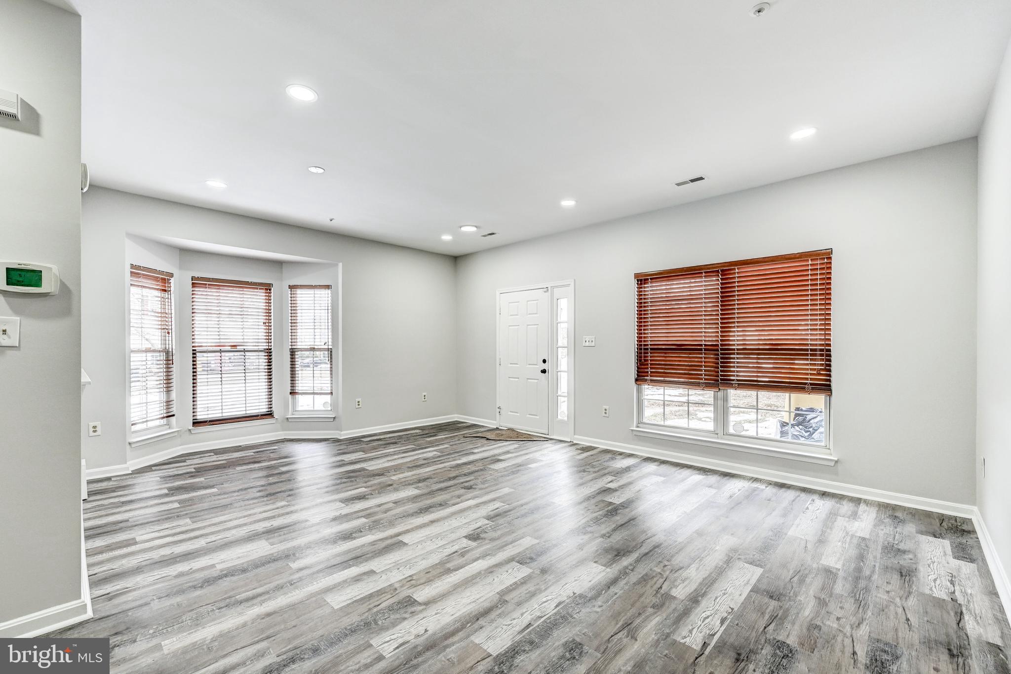 300 Roff Point Drive Odenton, MD 21113 - Photo 7 of 28 a view of an empty room with wooden floor and a window
