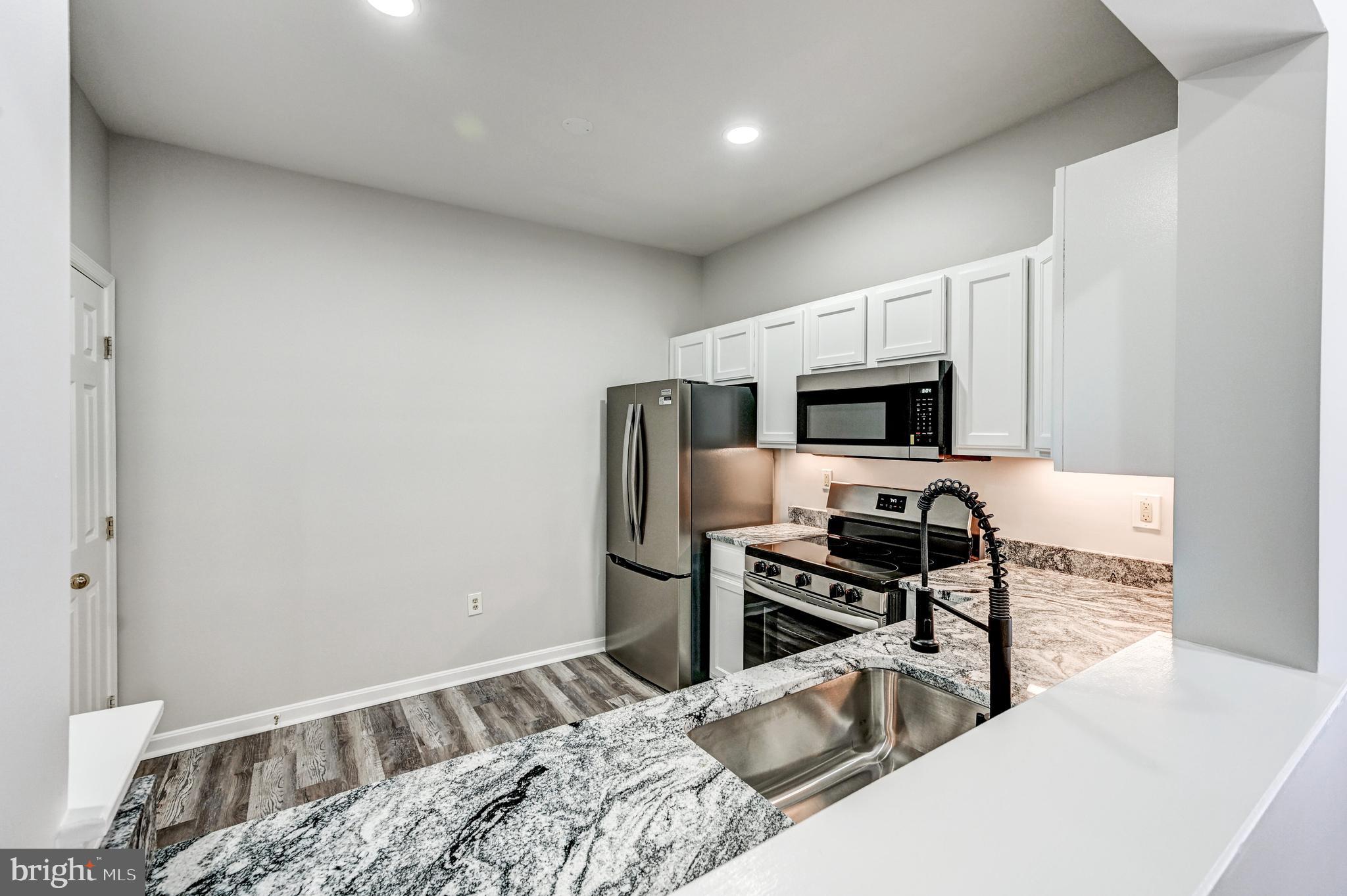 300 Roff Point Drive Odenton, MD 21113 - Photo 10 of 28 a bedroom with a bed and a television