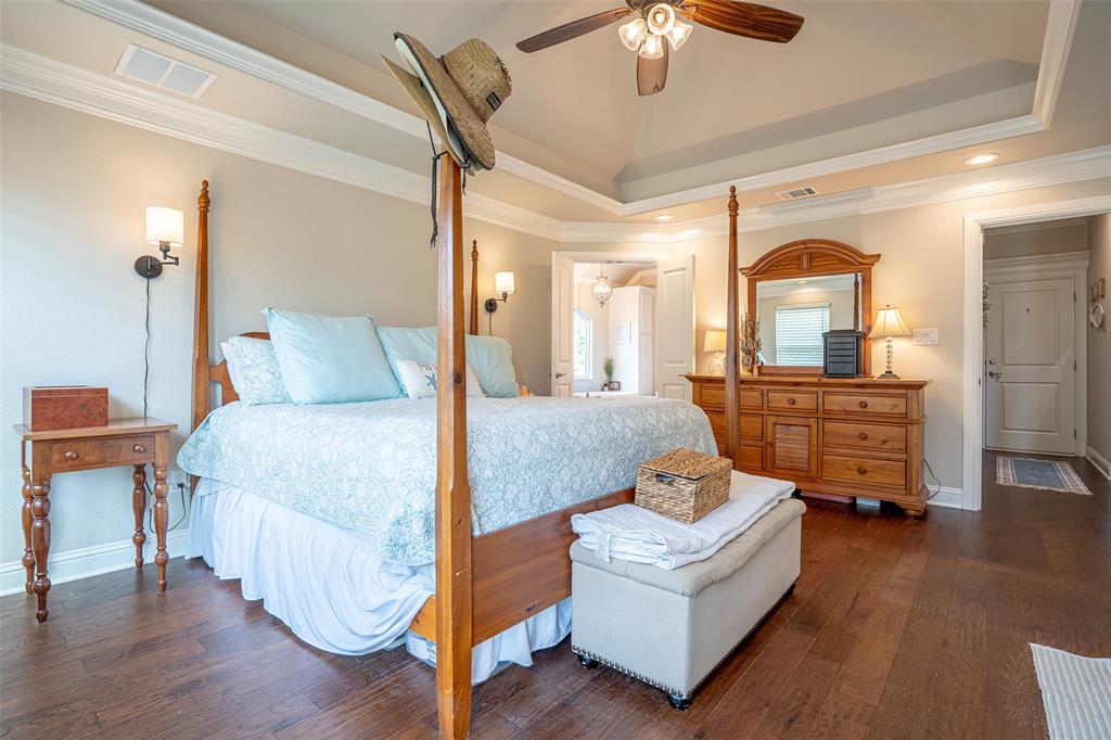 1920 Meander Road Granbury, TX 76049 - Photo 15 of 40 Hardwood-style flooring throughout this room, featuring a tray ceiling with crown molding