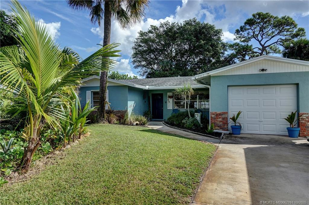 905 Southeast Flamingo Avenue Stuart, FL 34996 - Photo 2 of 36 a view of a house with backyard and sitting area