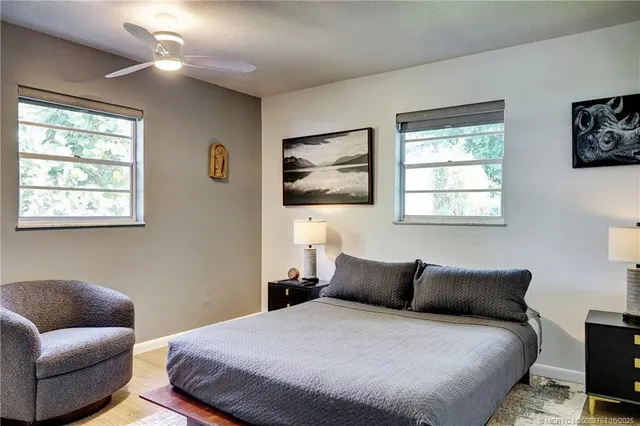 a bedroom with a bed and a couch