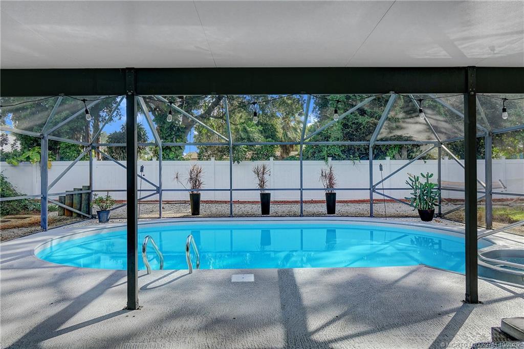 905 Southeast Flamingo Avenue Stuart, FL 34996 - Photo 24 of 36 a view of a backyard