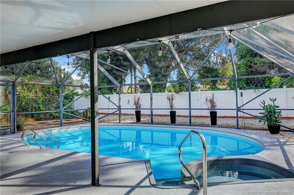 905 Southeast Flamingo Avenue Stuart, FL 34996 - Photo 25 of 36 a view of yard from deck with patio