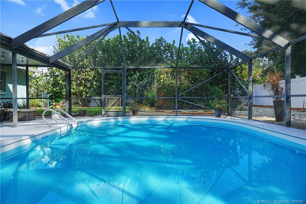 905 Southeast Flamingo Avenue Stuart, FL 34996 - Photo 27 of 36 a view of outdoor space with swimming pool