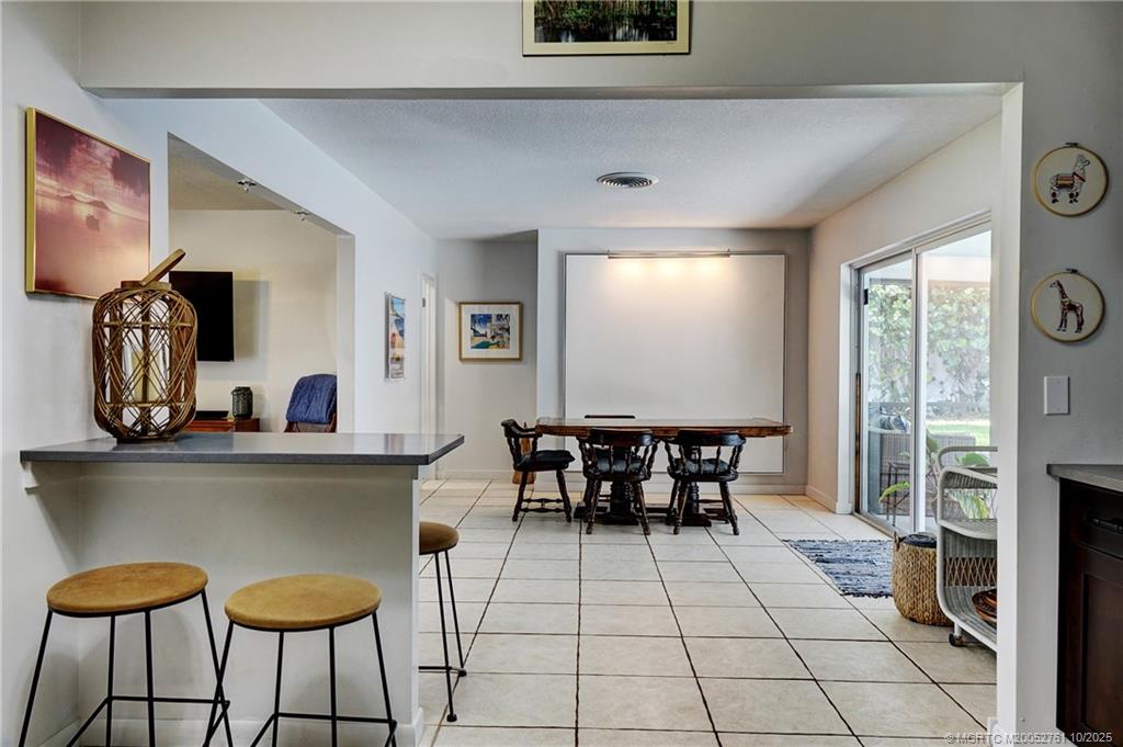 905 Southeast Flamingo Avenue Stuart, FL 34996 - Photo 8 of 36 a dining room with furniture and window