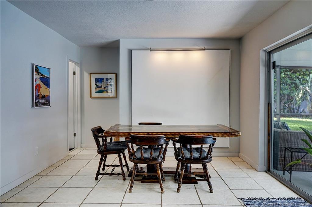 905 Southeast Flamingo Avenue Stuart, FL 34996 - Photo 9 of 36 a dining room with furniture and window