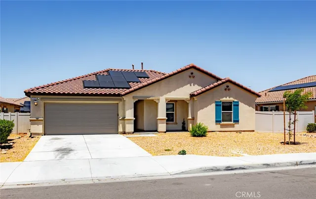a front view of a house with a outdoor space