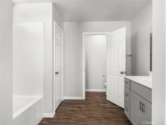 a bathroom with a sink a mirror and a bathtub