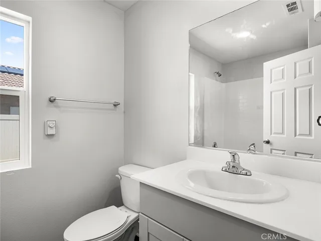 a bathroom with a bathtub and a window