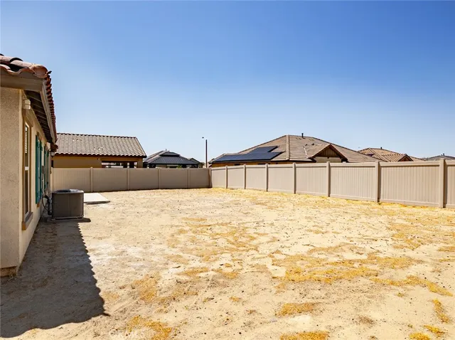 a view of a backyard of the house