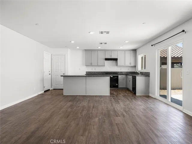 a view of kitchen with wooden floor and window