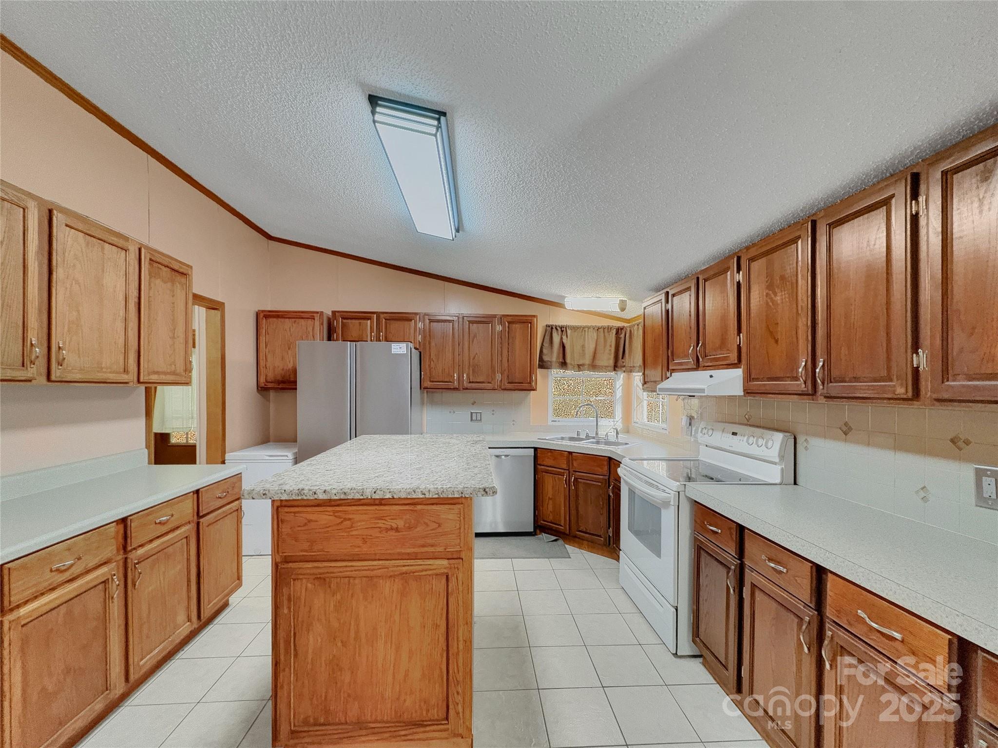 3215 Shadybark Trail Catawba, SC 29704 - Photo 11 of 36 a kitchen with stainless steel appliances granite countertop a sink counter space cabinets and a large window
