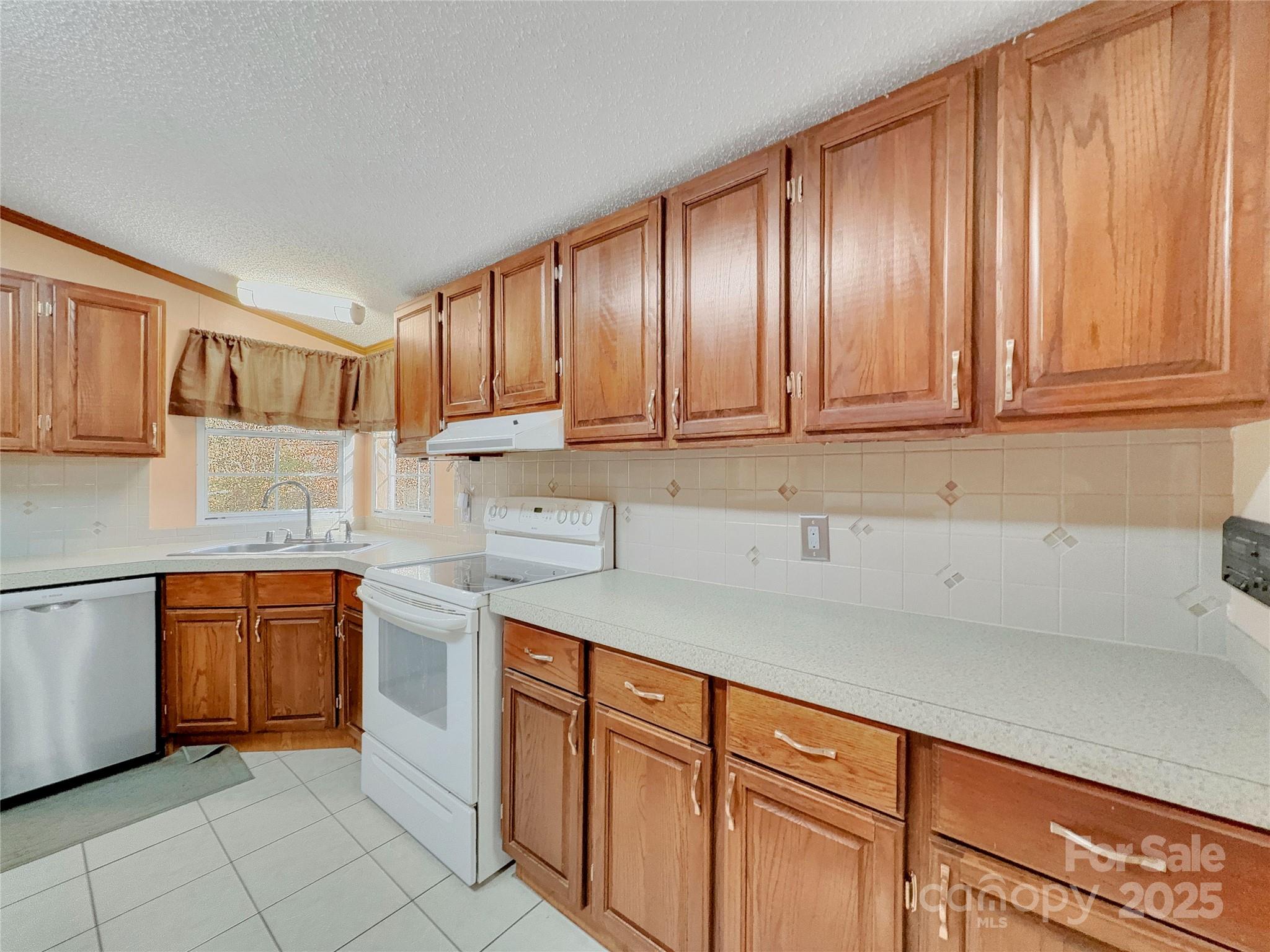 3215 Shadybark Trail Catawba, SC 29704 - Photo 12 of 36 a kitchen with stainless steel appliances granite countertop wooden cabinets a sink and dishwasher