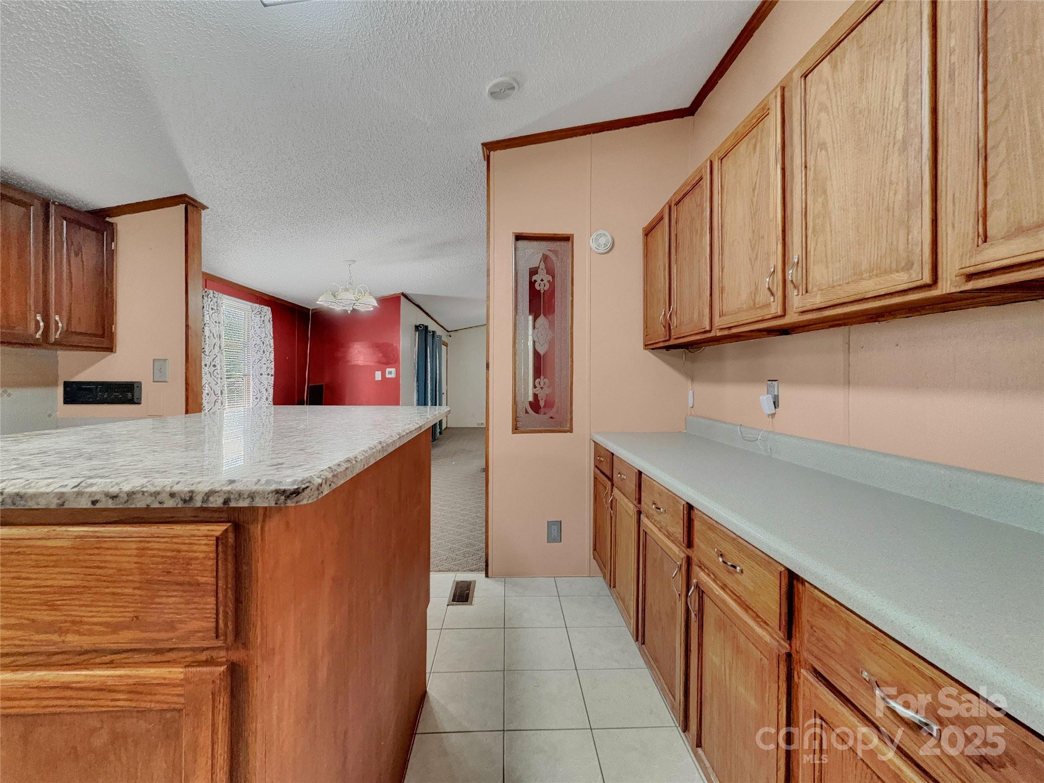 3215 Shadybark Trail Catawba, SC 29704 - Photo 13 of 36 a kitchen with stainless steel appliances granite countertop a sink and cabinets