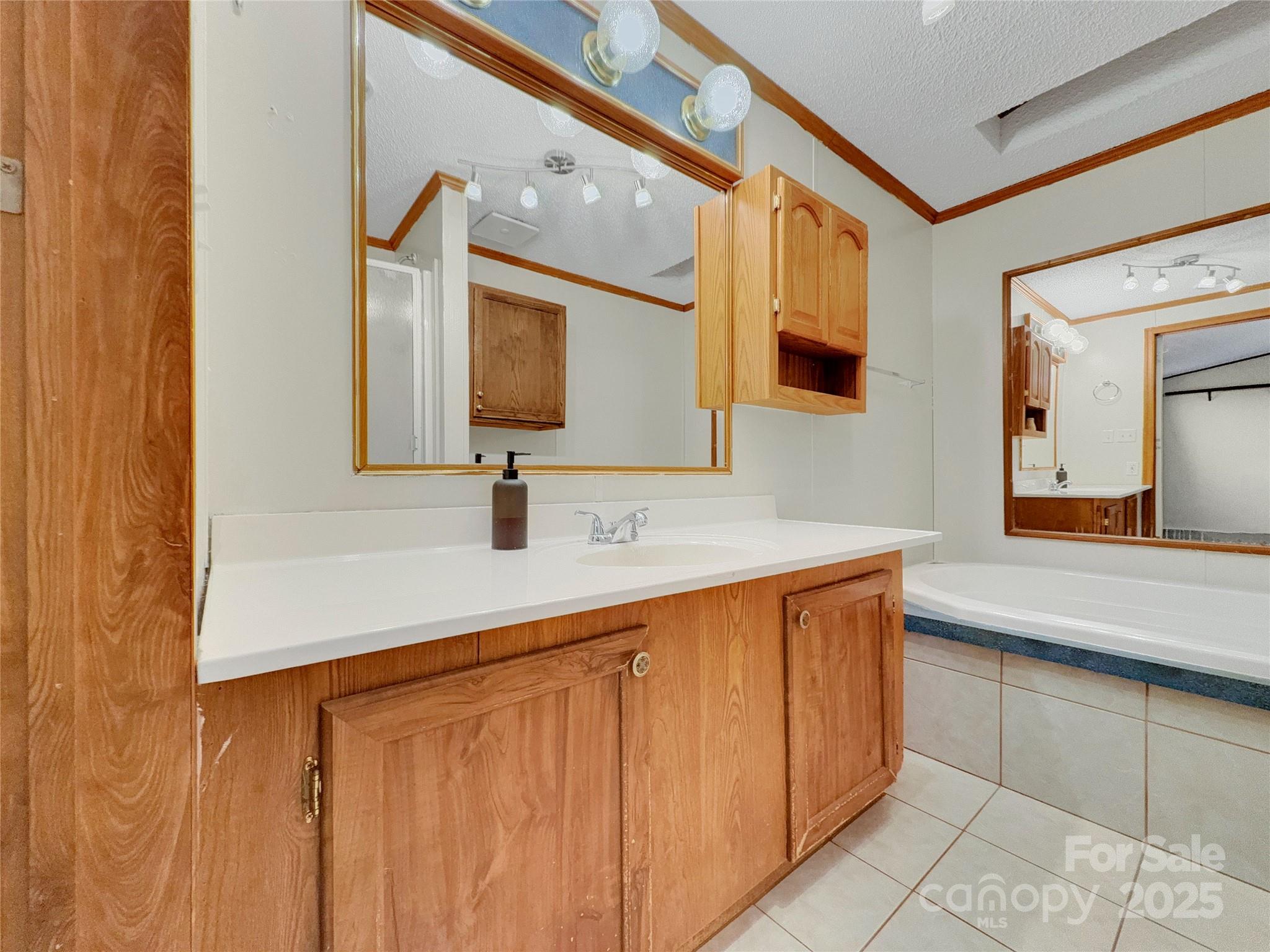 3215 Shadybark Trail Catawba, SC 29704 - Photo 19 of 36 a bathroom with a double vanity sink and mirror